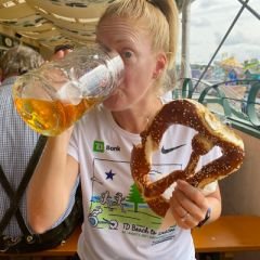 Jennifer Drinking a beer and holding a pretzel